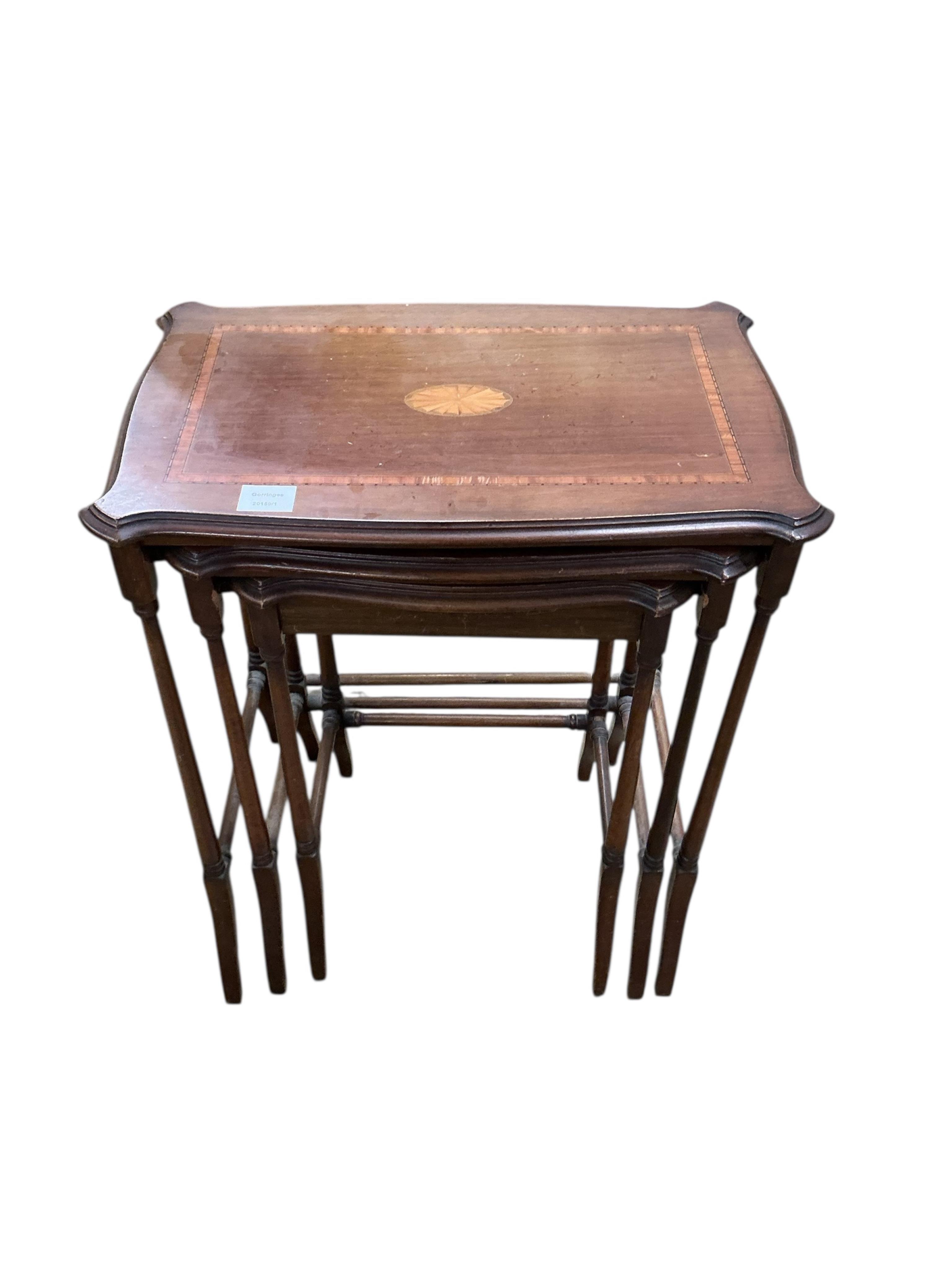 A nest of three Edwardian satinwood banded and inlaid rectangular serpentine tables, width 56cm, depth 36cm, height 66cm